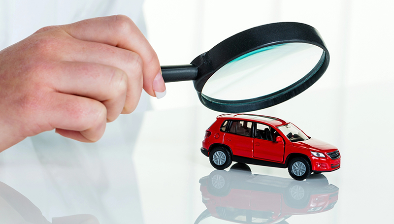 Close inspection of a vehicle, representing detailed auto insurance coverage