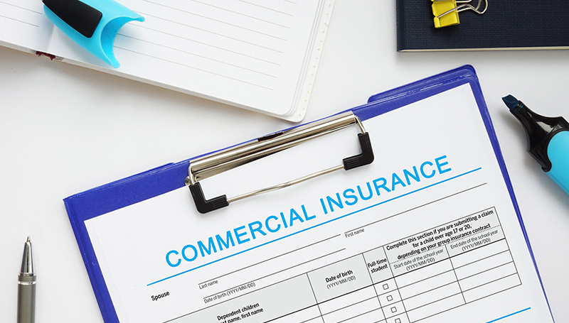 Clipboard with a commercial insurance form ready to be filled out