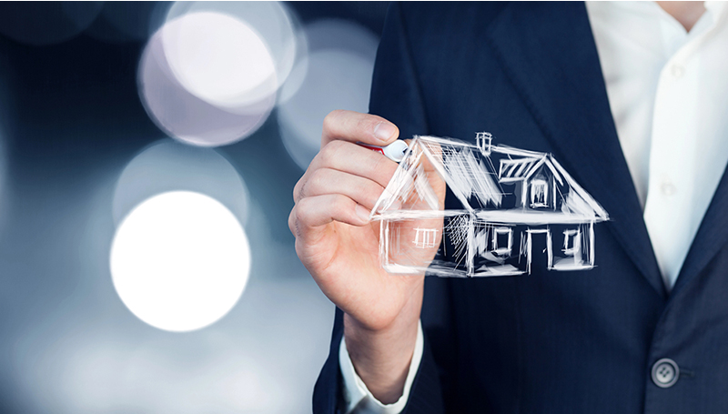Businessman sketching a house outline, representing homeowners insurance planning